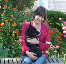 Maharishi School Director of Enrollment Managment Carol Chesnutt cuddles her puppy in Fairfield, Iowa.