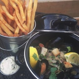 french fries, mussels, and aioli from the Cider House in Fairfield, Iowa. Photo credit: Cider House Instagram